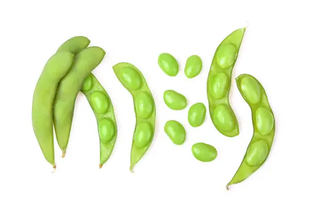 Green soy beans isolated on white background. Top view.