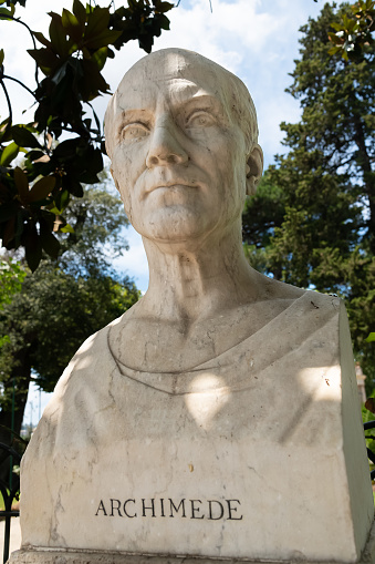 Bust of Archimedes, Greek mathematician, physicist, engineer, astronomer, and inventor, in the gardens of Villa Borghese, Rome, Italy 18.07.2021