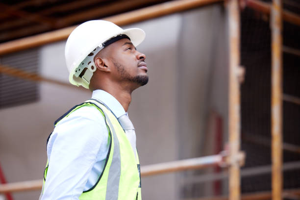 istock Shot of a young man working on a construction site outside 1359085075