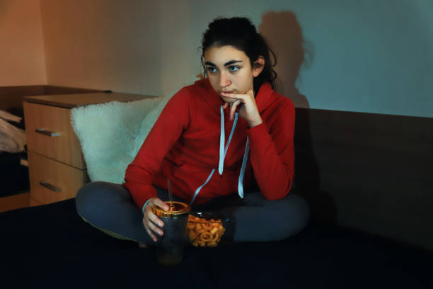 istock Girl watching TV 1359085121