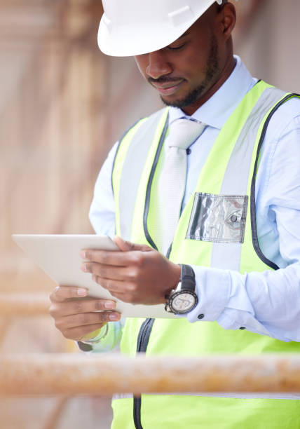 istock Shot of a young man working on a construction site outside 1359085275