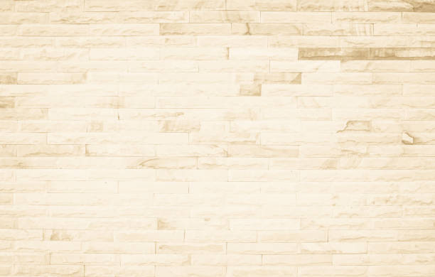 istock Empty background of wide cream brick wall texture. Beige old brown brick wall concrete or stone textured, wallpaper limestone abstract flooring/Grid uneven interior rock. Home decor design backdrop. 1359088609