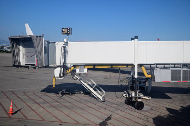 istock A sleeve for boarding passengers on a plane at a large airport 1359090278