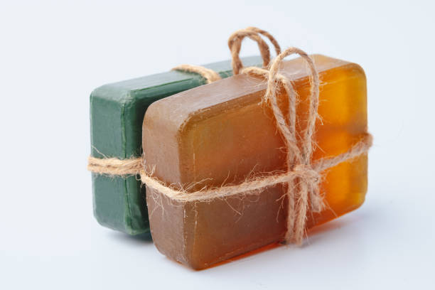 istock Natural soap bars tied with ribbon isolated on white 1359091525