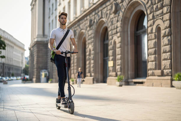 istock Student going to schhol on an electric scooter 1359092242