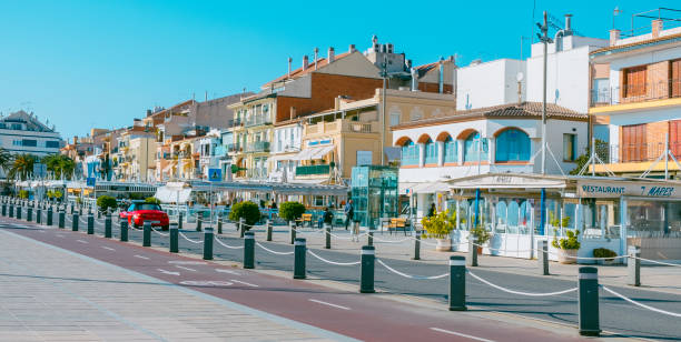 seafront of Cambrils, in Spain, web banner Cambrils, Spain - November 19, 2021: A view of the inner side of the seafront of Cambrils, in Spain, with many restaurants, in a web banner format cambrils stock pictures, royalty-free photos & images