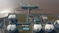 istock Real Time / Aerial View Of A Liquefied Natural Gas (LNG) Tanker Moored To The Jetty 1359094755
