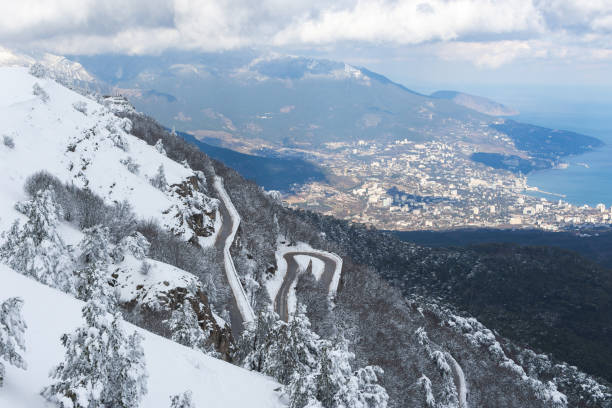 Winter Yalta view Ai-Petri. Mountain serpentine in the snow. stock photo