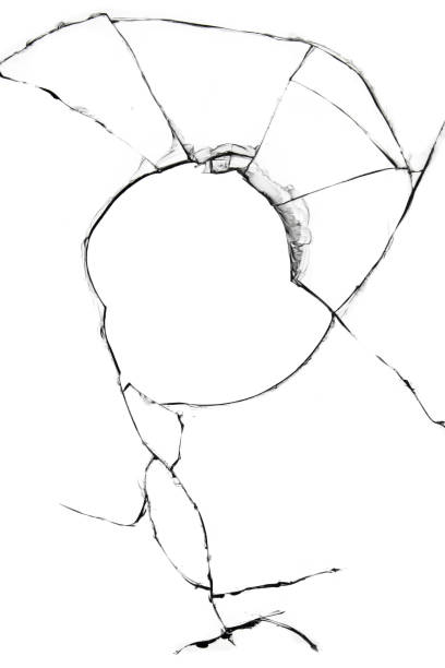 istock Cracked broken glass isolated on white background. 1359098091