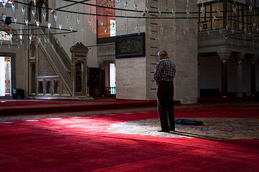 Muslim men praying time