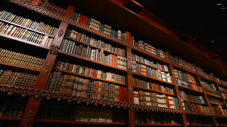 Old library or museum with vintage shelves full of classic literature books.