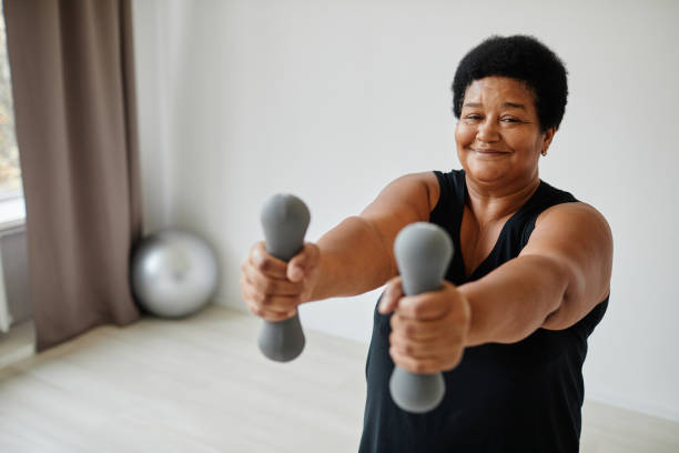 istock Active African American Senior Woman Exercising 1359105261