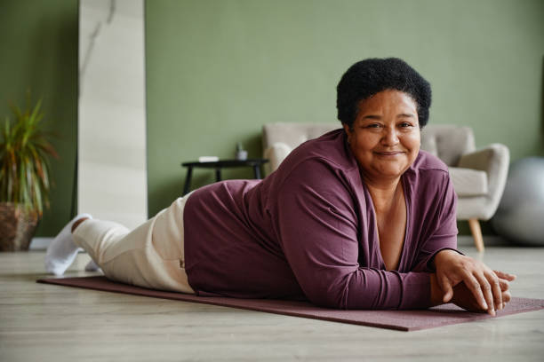 istock Black Senior Woman Enjoying Home Workout 1359105290