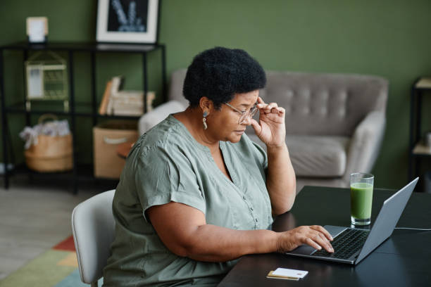 istock Black Senior Woman Using Laptop 1359105310