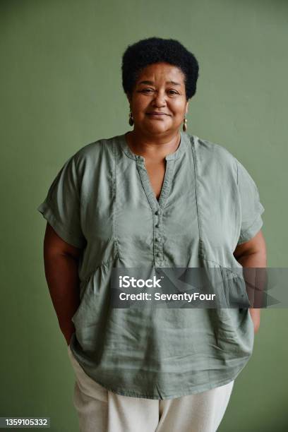 Portrait Of Black Senior Woman On Green Stock Photo - Download Image Now - Women, One Woman Only, African-American Ethnicity