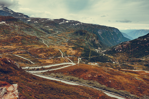 Summer mountains landscape in Norway, valley with winding road. National tourist scenic route 55 Sognefjellet.