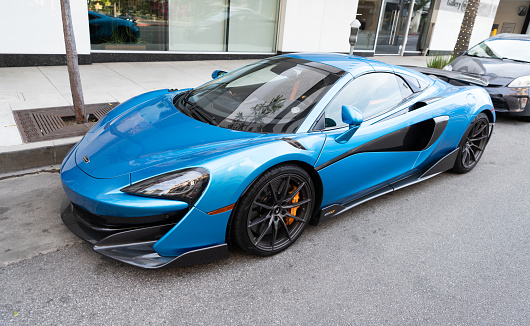 Los Angeles, California USA - April 14, 2021: blue McLaren Automotive Limited 720S luxury supercar parked in LA the U.S. state of California. front side view.