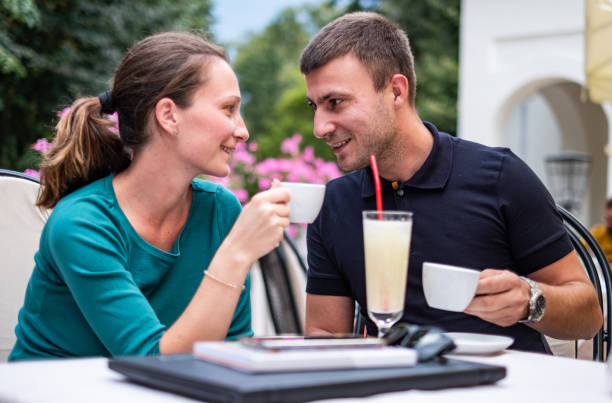 istock Men and women drinking coffee 1359109722