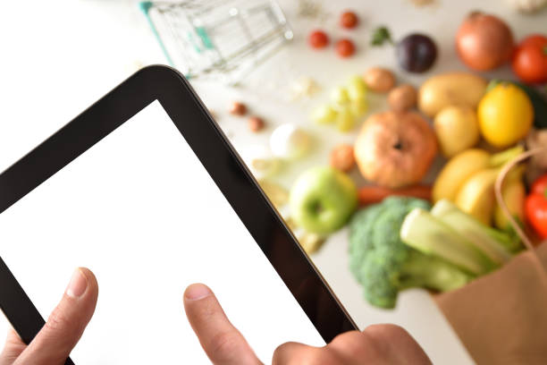 istock Pressing mobile device screen to place purchase order in supermarket 1359111610