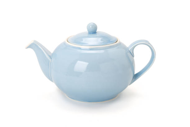 istock Side view of a blue china tea pot isolated on white background. Contains clipping path. 1359112244