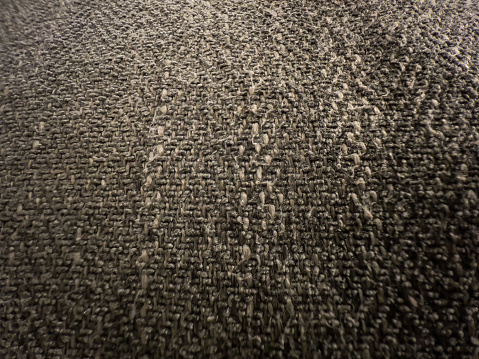 Fine dark fabric as texture or background.