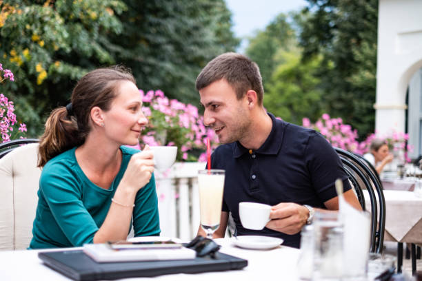 istock Young couple drinking coffee together 1359112332