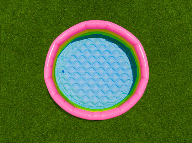 istock aerial view of a colorful round plastic pool. 1359115248