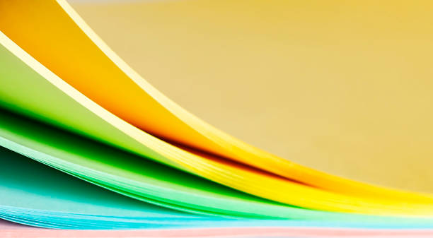 istock Sheets of a multi-colored paper on a white background 1359116152