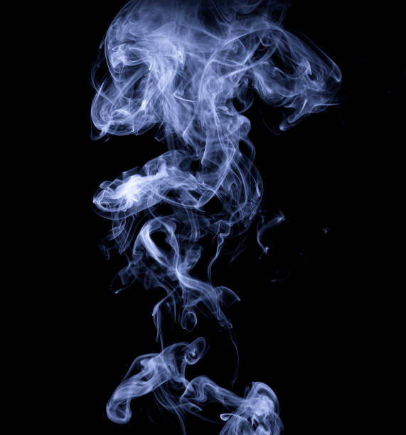 istock Clouds of smoke on a black background. Realistic isolated smoke 1359117591