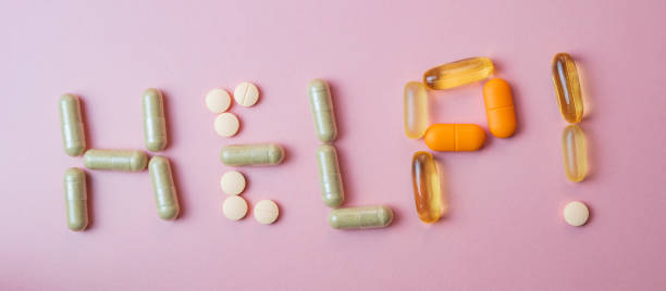 istock Help word made by pills and capsules 1359120813