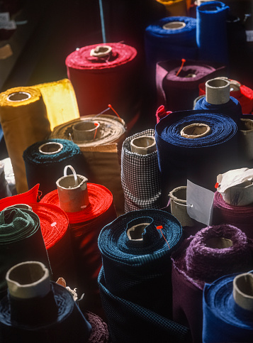 Tailer: Rolls of Colourful fabric.