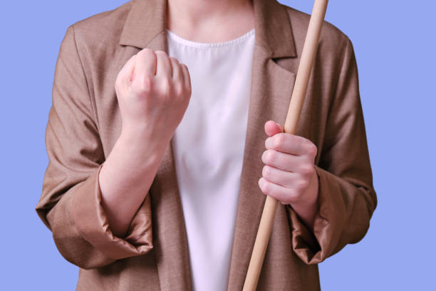 woman teacher shaking fist on studio blue background, copy space - concentration teacher business copy space imagens e fotografias de stock