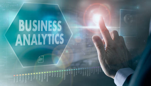 istock A businessman controlling a futuristic display with a Business Analytics concept on it. 1359128869