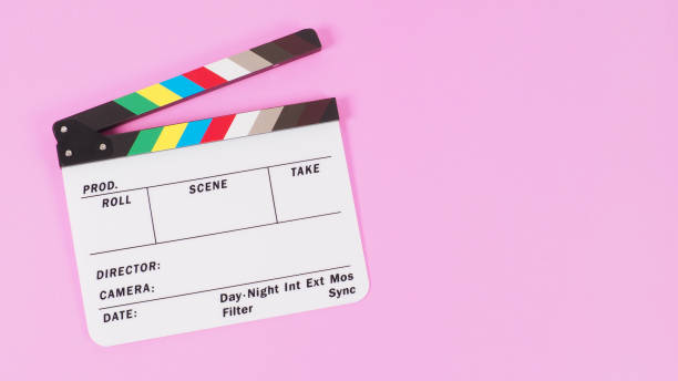 istock Clapper board or movie slate on pink background. 1359129270