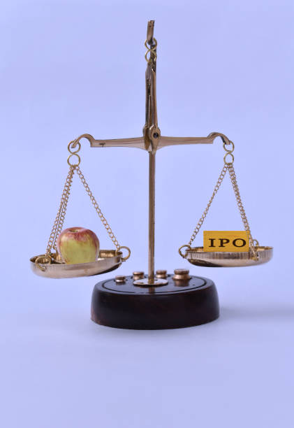 istock Apple Fruit and IPO written on blocks placed over weighing scale. 1359131567