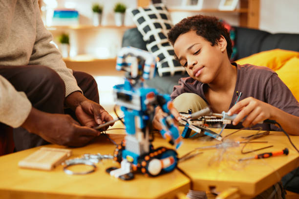 istock A grandad and grandson making a robot together at home. Education in robotics and electronics. 1359132162