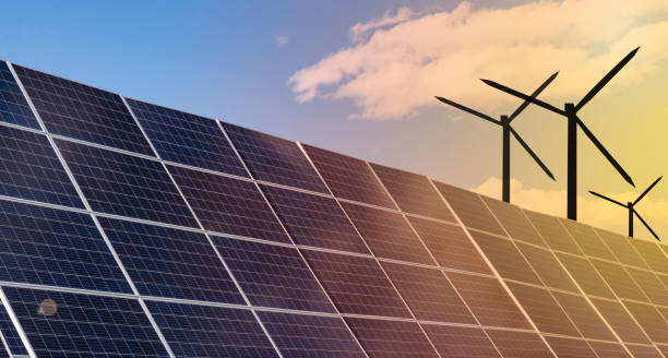 istock Green renewable energy sources wind and solar power turbines 1359133067