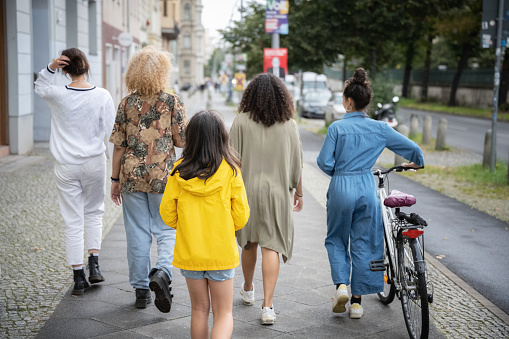 group of four teenage girls on street in Berlin Prenzlauer Berg