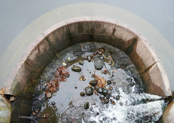 istock Old dam bridge water round waterfall drain runoff. Close-up view. 1359134864