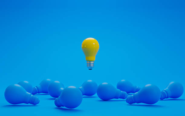 istock Yellow lightbulb floating from blue lightbulb on floor for creative thinking idea concept by 3d rendering. 1359135903