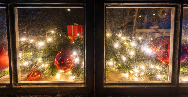 istock Christmas ornaments and illuminations shining by the window 1359136274
