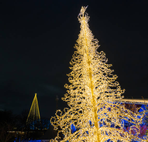 istock Two big golden Christmas trees 1359136520