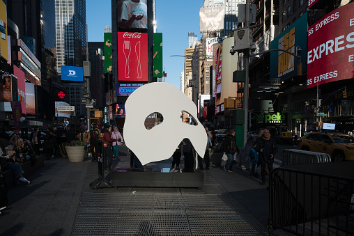 Manhattan, New York. December 13, 2021. The Mask of the Phantom of the Opera broadway show on display in Times Square.