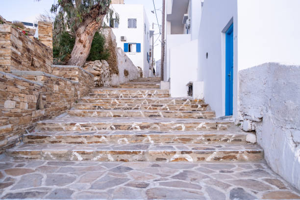 Cyclades, Greece. Ios, Nios island, Chora. Whitewashed buildings and empty cobblestone paved stairs, traditional architecture.
