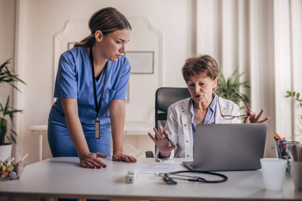 istock Female doctor and nurse working 1359138947
