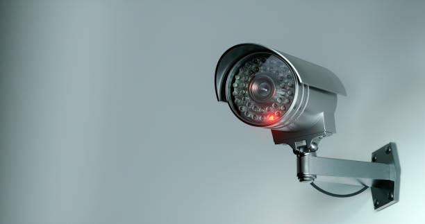 istock Futuristic security cameras scanning the street 1359139550