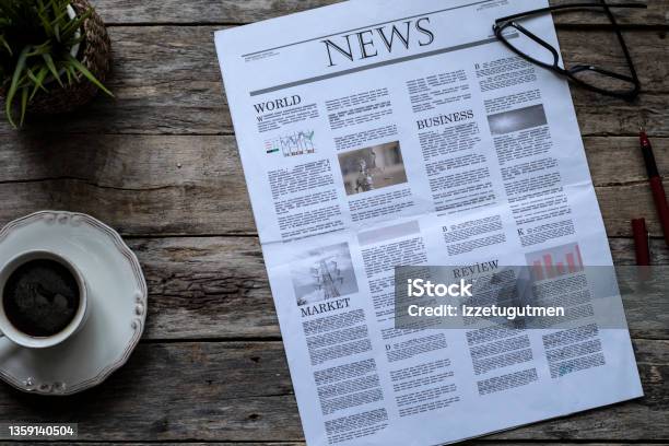 Daily Newspaper Over Wooden Table Stock Photo - Download Image Now - Newspaper, The Media, News Event