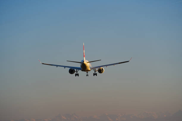 Swiss airplane landing at Zürich Airport on a sunny winter late afternoon. Photo taken December 13th, 2021, Zurich, Switzerland.