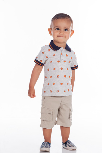 Latino boy from Bogota Colombia between 2 and 3 years old, looking at the camera in a cute portrait in a studio.