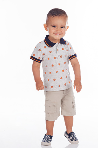 Latino boy from Bogota Colombia between 2 and 3 years old, looking at the camera in a cute portrait in a studio.